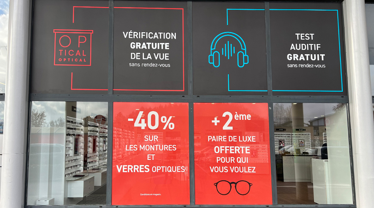 impression-pose-vinyle-micro-perforé-optical-center-arlon-01 Impression et pose de plusieurs vinyles pleins et micro-perforés pour Optical Center à Arlon